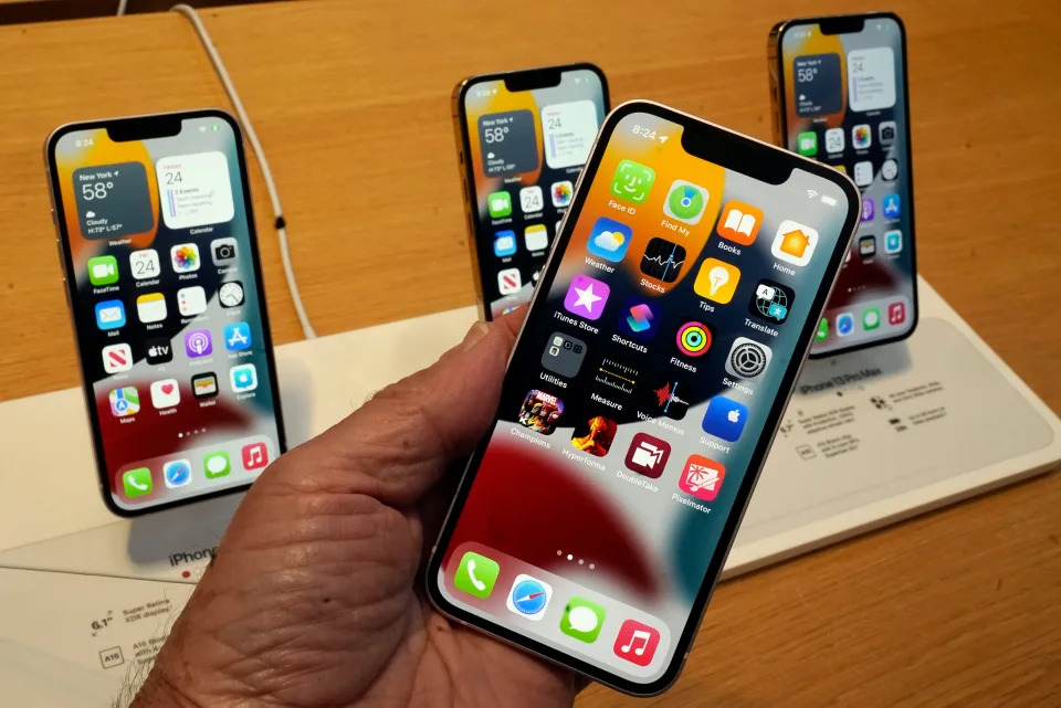 The line-up of the Apple iPhone 13 is displayed on their first day of sale, in New York, Friday, Sept. 24, 2021, iPhone 13 mini, foreground, iPhone 13, iPhone 13 Pro, and iPhone 13 ProMax, left to right, background.