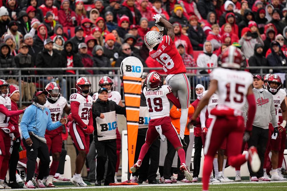 Ohio State receiver Marvin Harrison Jr. catches a pass over Indiana's Josh Sanguinetti on Saturday.
