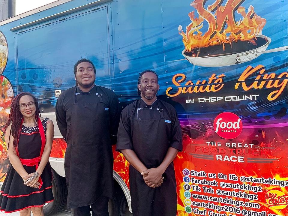 Sauté Kingz owners Jessica Foreman (left) and Count Thomas James Foreman (right), with their son Jesshuan Foreman (middle) in front of the Sauté Kingz food trailer.