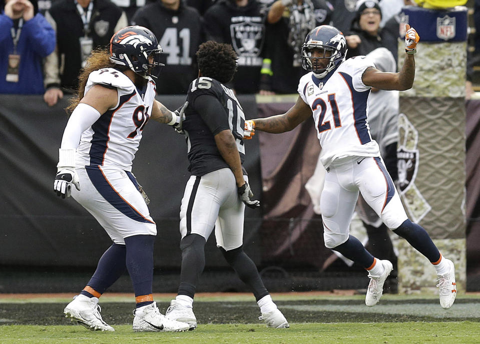 <p>Oakland Raiders wide receiver Michael Crabtree, center, fights with Denver Broncos nose tackle Domata Peko, left, and cornerback Aqib Talib during the first half of an NFL football game in Oakland, Calif., Sunday, Nov. 26, 2017. Crabtree and Talib were ejected. (AP Photo/Ben Margot) </p>