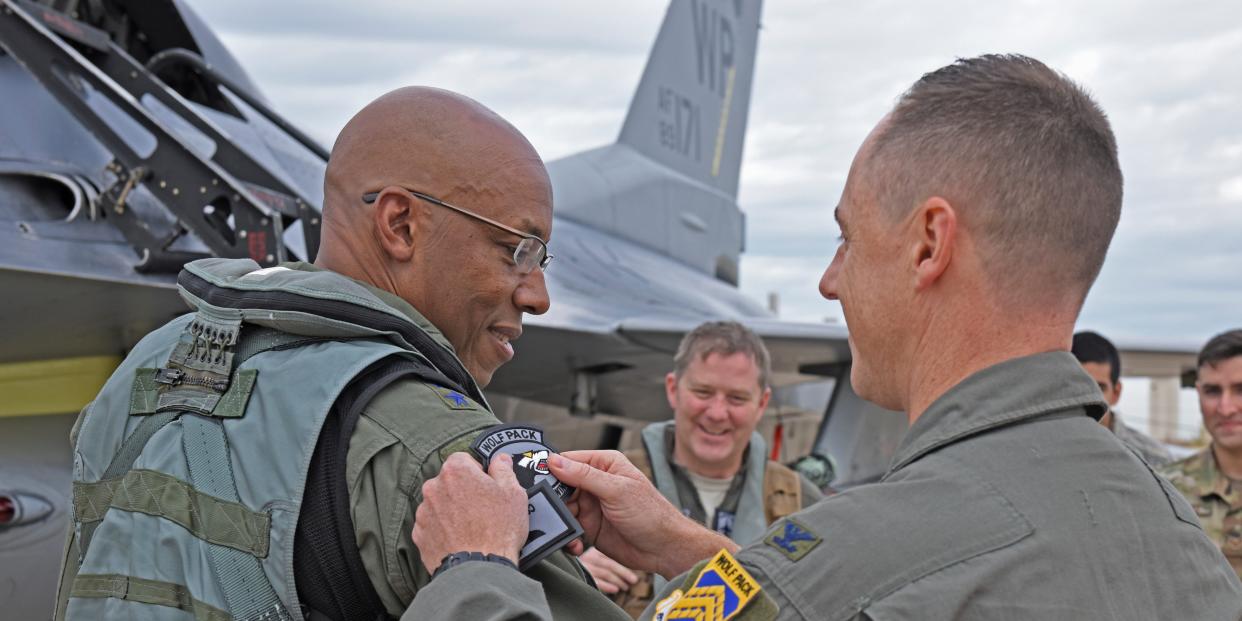 Air Force Gen. CQ Brown, Jr. receiving a Wolf Pack patch during a visit at Kunsan Air Base, Republic of Korea, Oct. 18, 2019.