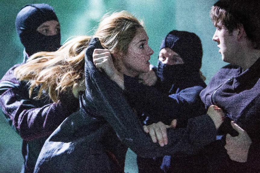 This publicity photo released by Summit Entertainment shows Shailene Woodley, left, and Christian Madsen in a scene from the film, "Divergent." (AP Photo/Summit Entertainment, Jaap Buitendijk)