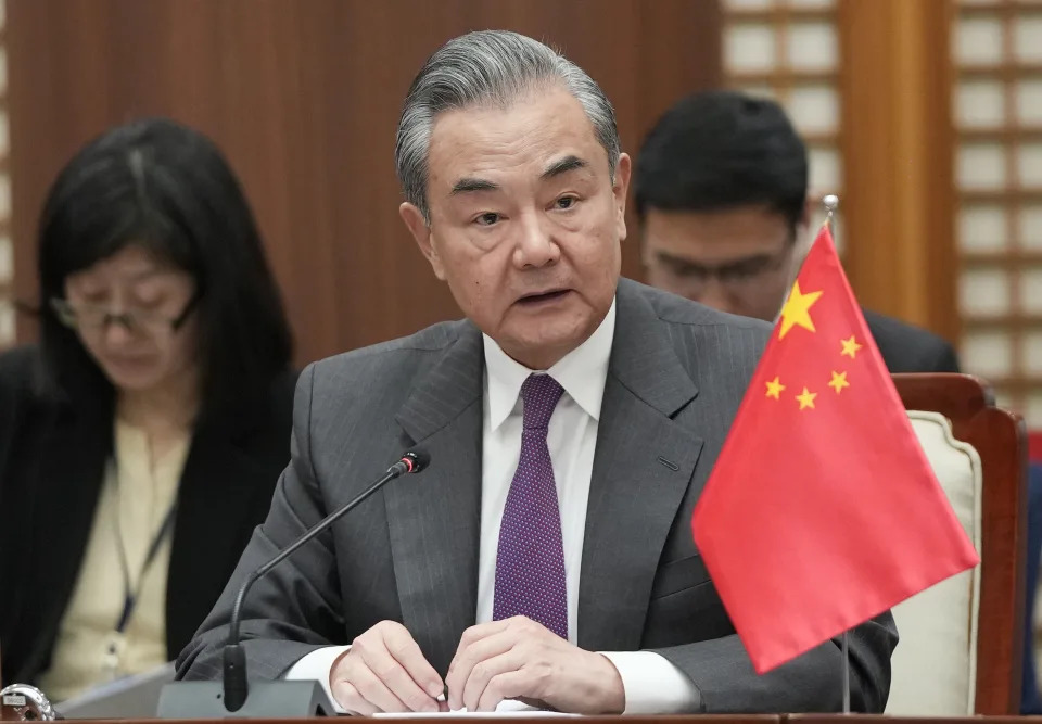 FILE - Chinese Foreign Minister Wang Yi speaks during the trilateral foreign ministers' meeting with South Korea and Japan, in Busan, South Korea, Sunday, Nov. 26, 2023. Foreign Minister Wang said Wednesday, Dec. 20, 2023, the country will maintain military pressure on the Philippines amid a dispute over sovereignty in the South China Sea that could involve U.S. forces defending their treaty partner.(AP Photo/Ahn Young-joon. Pool, File)