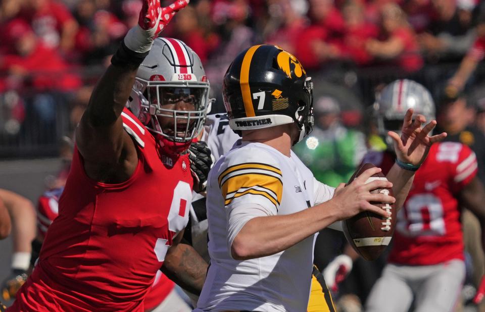 Oct 22, 2022; Columbus, Ohio, USA; Ohio State Buckeyes defensive end Zach Harrison (9) attempts to sack Iowa Hawkeyes quarterback Spencer Petras (7) during their NCAA Division I football game between the Ohio State Buckeyes and the Iowa Hawkeyes at Ohio Stadium. Mandatory Credit: Brooke LaValley/Columbus Dispatch