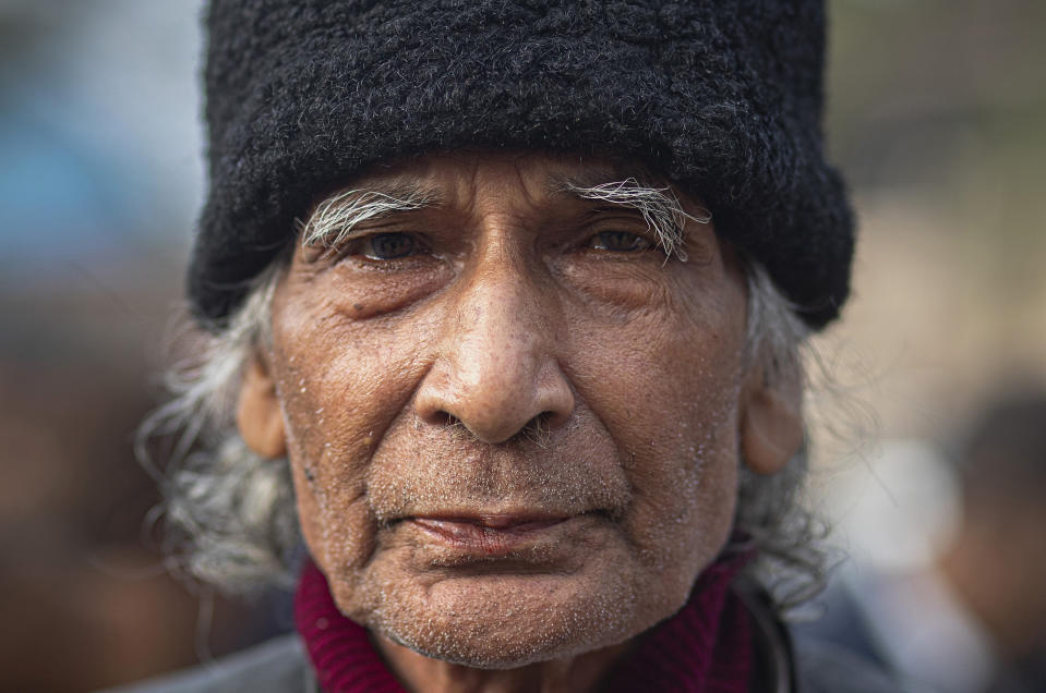 In this Monday, Dec. 23, 2019, photo, Gajendra Nath Pathak, 81, participates in a protest against Citizenship Amendment Act in Gauhati, India. Tens of thousands of protesters have taken to India’s streets to call for the revocation of the law, which critics say is the latest effort by Narendra Modi’s government to marginalize the country’s 200 million Muslims. Pathak said that he would resist the Act the last drop of his blood and not allow it to be implemented. (AP Photo/Anupam Nath)