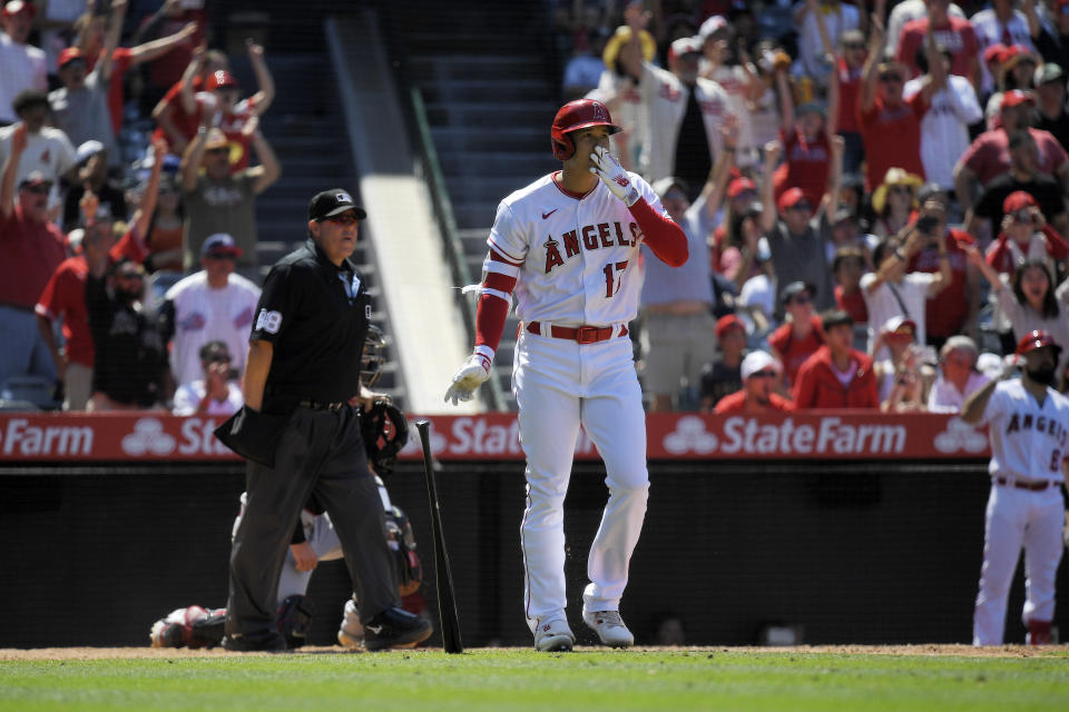 Los Angeles Angels' Shohei Ohtani heads to first after hitting a solo home run during the eighth inning of a baseball game against the Arizona Diamondbacks Sunday, July 2, 2023, in Anaheim, Calif. (AP Photo/Mark J. Terrill)