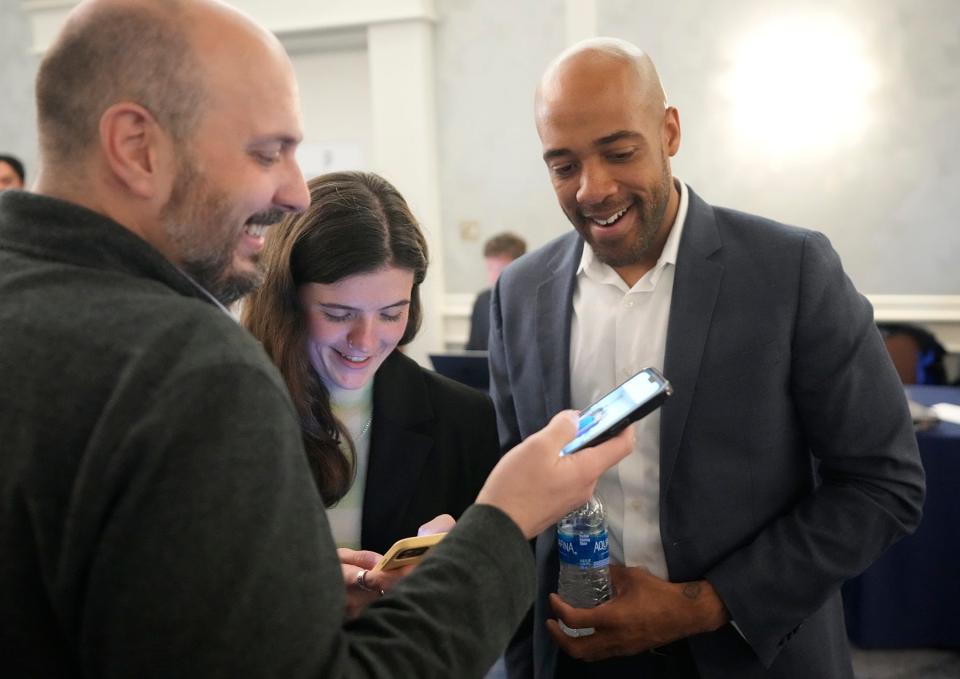 Former Lt. Gov. Mandela Barnes, right, and others  watch the results come in during Supreme Court candidate Janet Protasiewicz's election night watch party.