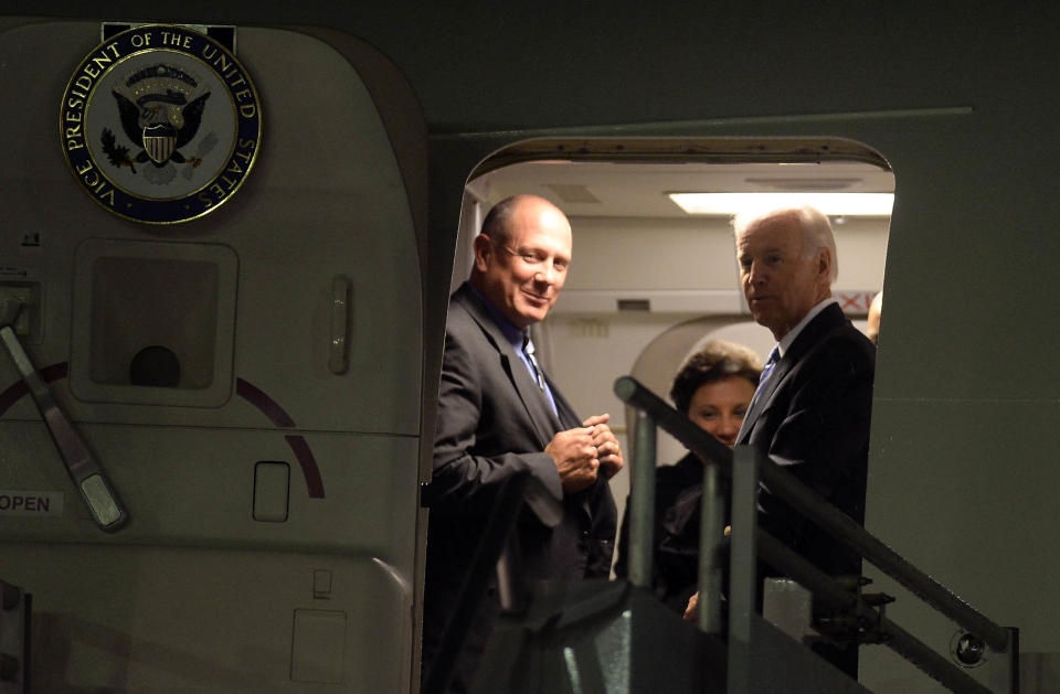 US Vice President Joe Biden (R) alights from the plane upon arrival at the Benito Juarez international airport in Mexico City, on September 19, 2013 for a one-day official visit.