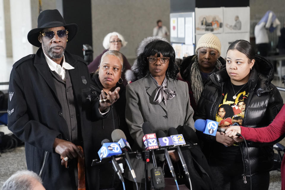R. Kelly's uncle Gregory Preston, left, and other family members talk to reporters at the Dirksen Federal Building after Kelly's sentencing hearing Thursday, Feb. 23, 2023, in Chicago. R. Kelly was sentenced on Thursday to 20 years in prison for child pornography and enticement of minors for sex but will serve all but one of those simultaneously with a 30-year sentence on racketeering and sex trafficking convictions. (AP Photo/Charles Rex Arbogast)