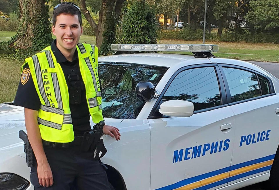 Officer Joseph McKinney smiles next to a police car. (Memphis Police Dept. / via Facebook)