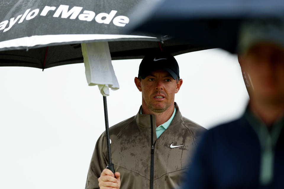 Rory McIlroy under an umbrella