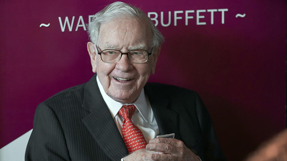 CORRECTS COMPANY INVESTMENTS - FILE - Warren Buffett, chairman and CEO of Berkshire Hathaway, smiles as he plays bridge following the annual Berkshire Hathaway shareholders meeting in Omaha, Neb., on May 5, 2019. Buffett's company bet more on high-tech darling Apple during the second quarter, while also investing billions in old-school oil producers Occidental Petroleum and Chevron. (AP Photo/Nati Harnik, File)