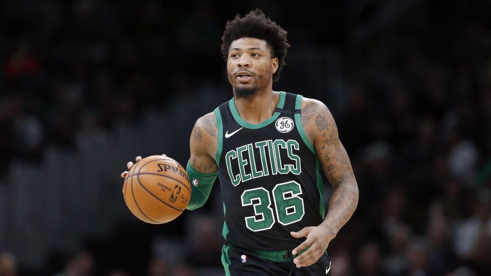 Marcus Smart announced that he has joined a growing list of NBA players confirmed with COVID-19. (AP Photo/Michael Dwyer)