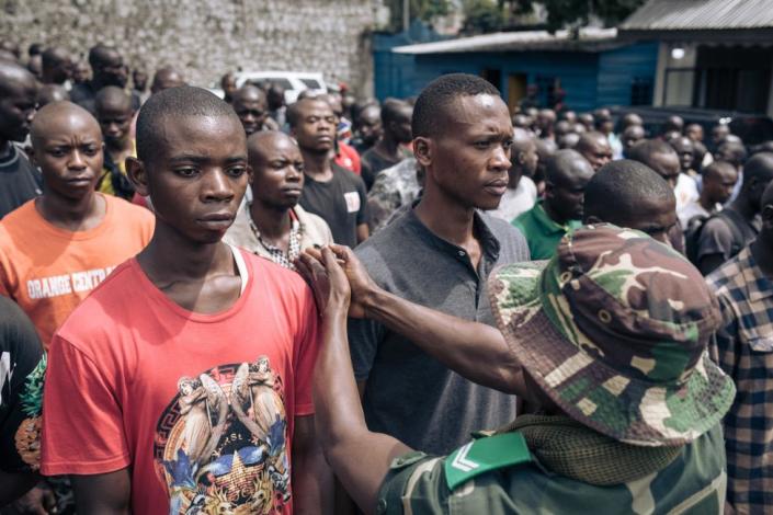 Hundreds of volunteers take part in a session to enlist new recruits into the Congolese army to go to the front against the M23 (March 23 Movement) rebellion, in Goma, on November 7, 2022. - Since October 20, fighting has resumed between the Congolese army and the M23, allegedly backed by the Rwandan army. In the past two weeks, the M23 has doubled the size of the territory under its control, approaching 30 kilometers from Goma, the provincial capital of more than one million people that sits on the border with Rwanda.