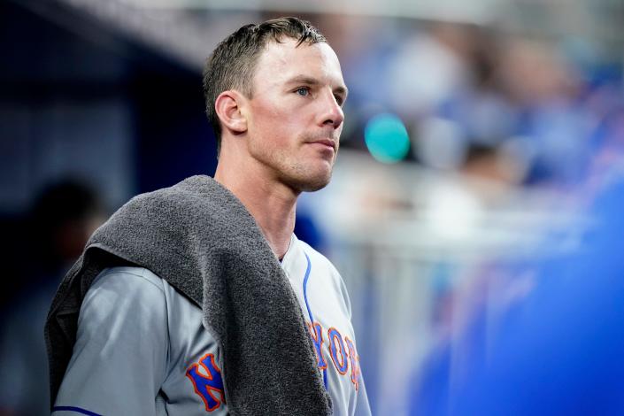 New York Mets starting pitcher Chris Bassitt looks out from the dugout after pitching in the fourth inning of a baseball game against the Miami Marlins, Saturday, June 25, 2022, in Miami. The Marlins scored two runs in the inninng.