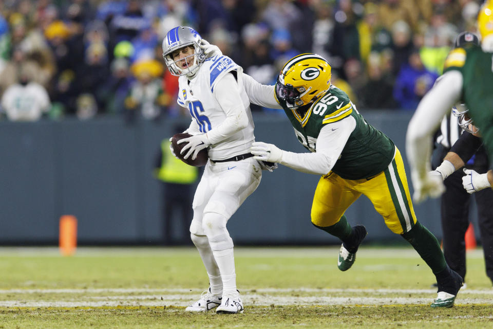 Jan 8, 2023; Green Bay, Wisconsin, USA; Detroit Lions quarterback Jared Goff (16) is sacked by Green Bay Packers defensive lineman <a class="link " href="https://sports.yahoo.com/nfl/players/33983" data-i13n="sec:content-canvas;subsec:anchor_text;elm:context_link" data-ylk="slk:Devonte Wyatt;sec:content-canvas;subsec:anchor_text;elm:context_link;itc:0">Devonte Wyatt</a> (95) during the second quarter at Lambeau Field. Mandatory Credit: Jeff Hanisch-USA TODAY Sports