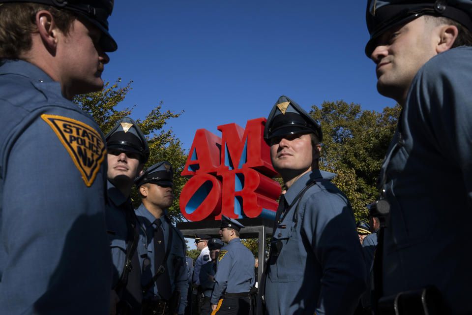 Law enforcement officers gather for a service for officer Richard Mendez at the Cathedral Basilica of Saints Peter and Paul in Philadelphia, Tuesday, Oct. 24, 2023. Mendez was shot and killed, and a second officer was wounded when they confronted people breaking into a car at Philadelphia International Airport, Oct. 12, police said. (AP Photo/Joe Lamberti)