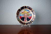 A plate with a picture of Russian President Vladimir Putin and the phrase "Crimea is ours" is seen in in this photo illustration taken in a hotel room in Kazan, Russia, July 24, 2015. REUTERS/Stefan Wermuth