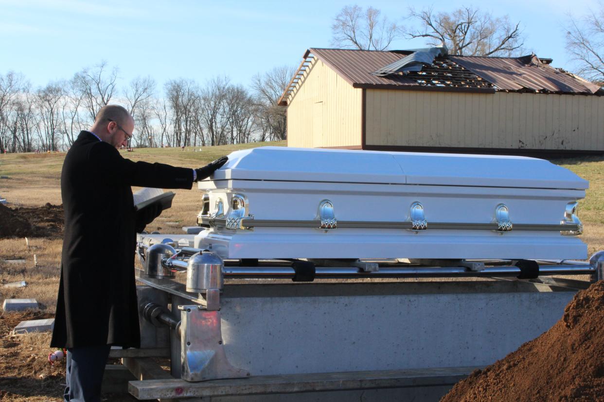 Brian Marcoulier, lead pastor of Bellevue United Methodist Church, praying at a funeral service on Jan. 26, 2022 for Call the Name, an initiative in which local clergy honor individuals who were deemed abandoned at the time of their death.