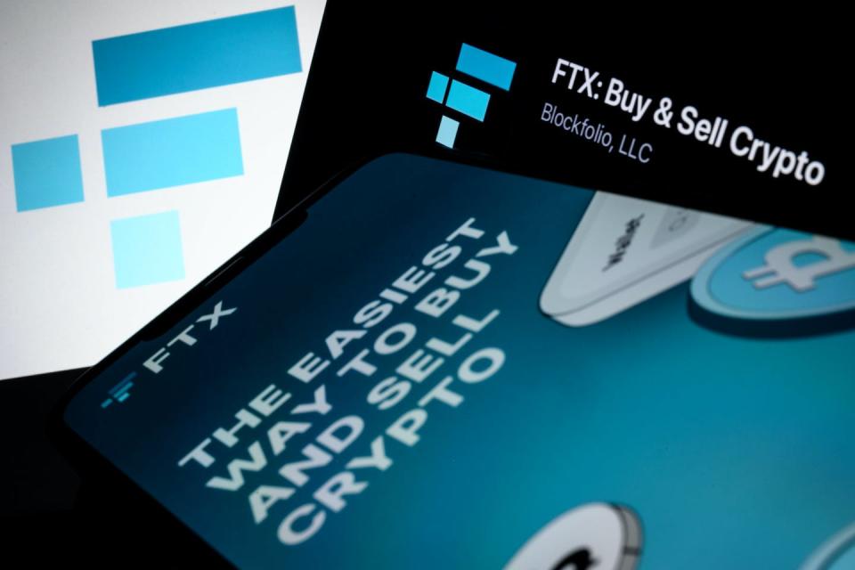 FTX logo and mobile app ads seen November 10, 2022, one day before the cryptocurrency exchange initiated Chapter 11 bankruptcy proceedings. <a href="https://www.gettyimages.com/detail/news-photo/in-this-photo-illustration-the-ftx-logo-and-mobile-app-news-photo/1440504670?adppopup=true" rel="nofollow noopener" target="_blank" data-ylk="slk:Leon Neal/Getty Images;elm:context_link;itc:0;sec:content-canvas" class="link ">Leon Neal/Getty Images</a>