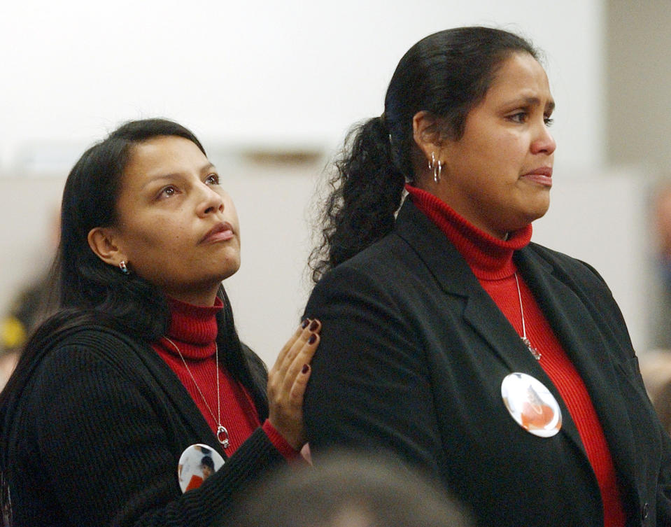 LuAnna Yellow Robe, left, and her sister Rona Walsh address Gary Ridgway in court in Seattle in 2003. (Elaine Thompson / Pool via Getty Images)