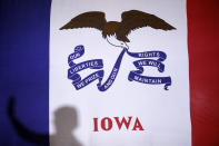 Democratic presidential candidate Sen. Elizabeth Warren, D-Mass., casts a shadow on an Iowa state flag as she speaks during a campaign event, Friday, Jan. 17, 2020, in Newton, Iowa. (AP Photo/Patrick Semansky)