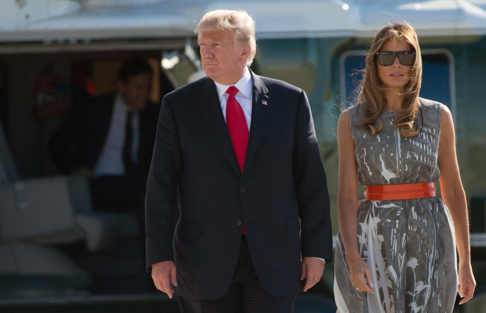 <p>President Donald Trump and First Lady Melania Trump make their way to board Airforce One after the G20 Summit in Hamburg, Germany, July 8, 2017. (Photo: Saul Loeb /AFP/Getty Images) </p>