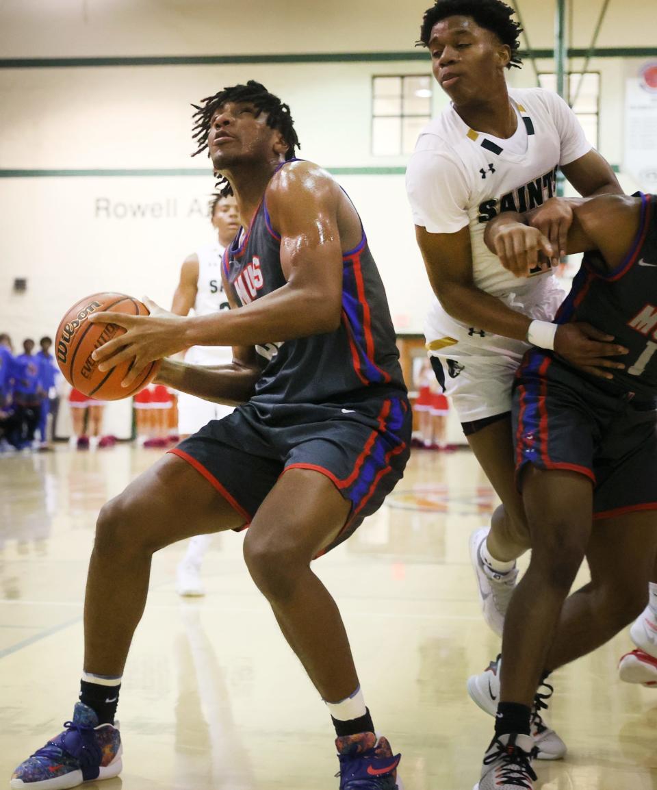 Memphis University School's R'chaun King looks to put up a shot in the lane during their game at Briarcrest Christian School on Friday, Feb. 11, 2022. 