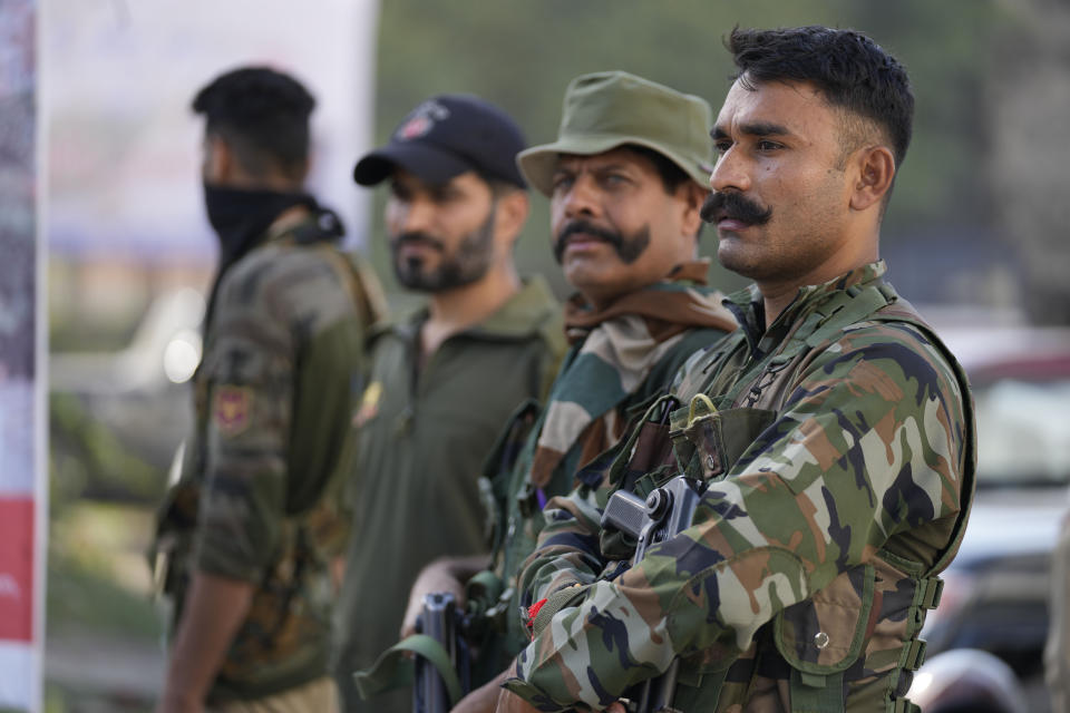 Jammu and Kashmir policemen patrol a street in Jammu, India, Tuesday, Oct. 4, 2022. The prisons chief in Indian-controlled Kashmir has been killed, officials said Tuesday, as India’s powerful home minister arrived in the disputed Himalayan region on a three-day visit. (AP Photo/Channi Anand)