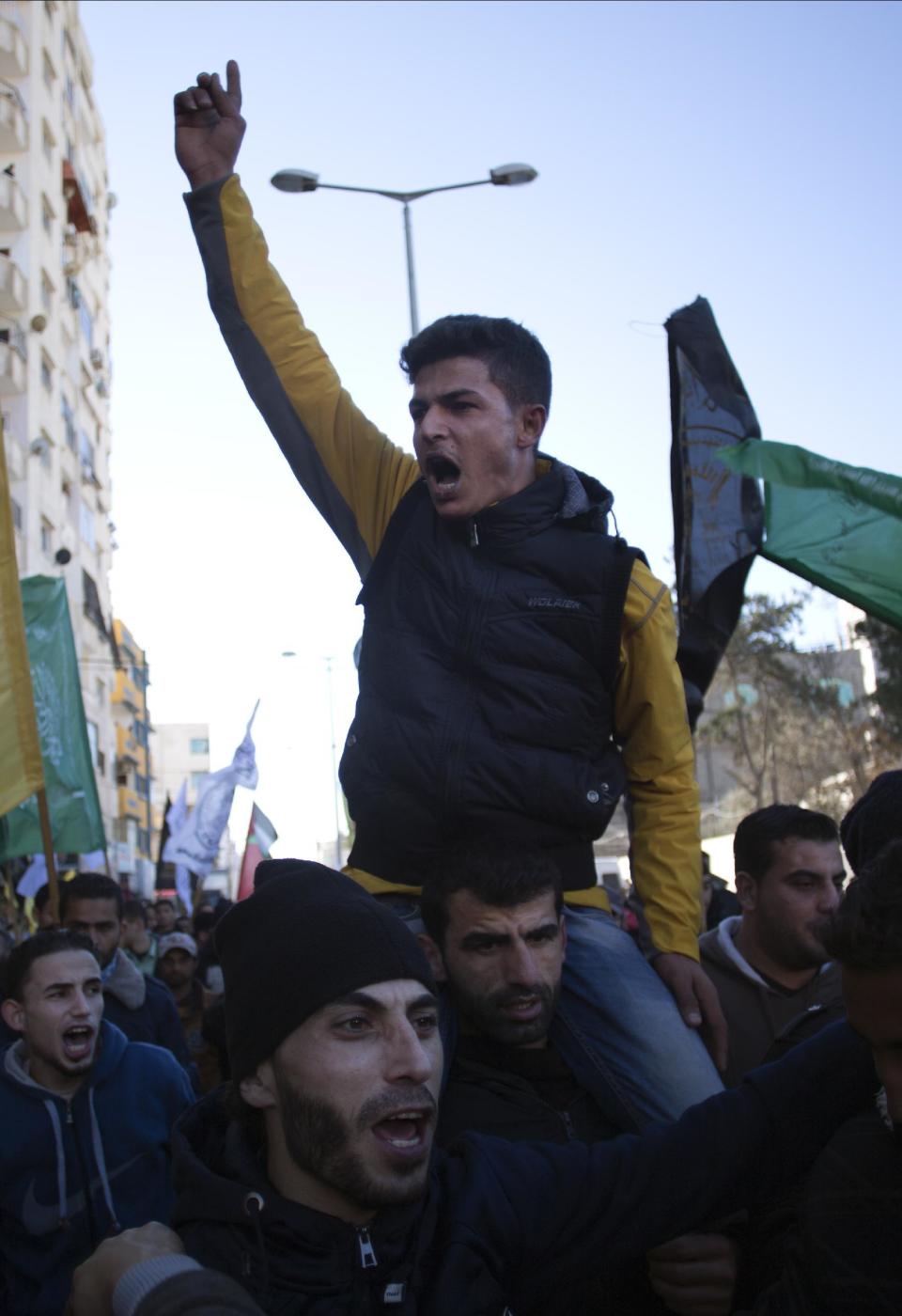 Palestinians chant angry slogans as they attend a symbolic funeral of a missing fisherman, Mohammed Al-Hissi, 33, in Gaza City, Saturday, Jan. 7, 2017. The family of a Palestinian fisherman who disappeared after boat collision with an Israeli navy vessel off Gaza coast declared him dead Saturday after three days of search, accusing the Israeli military of deliberately sinking the fishing boat. (AP Photo/Khalil Hamra)