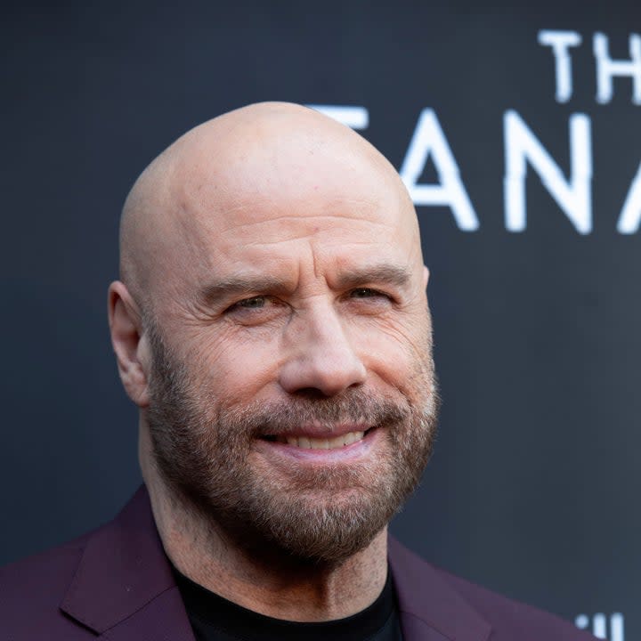 John Travolta smiling at a movie premiere