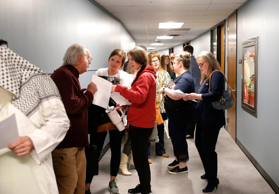 People wait in line to make public comment Thursday during a meeting with the Oklahoma State Board of Education in Oklahoma City.