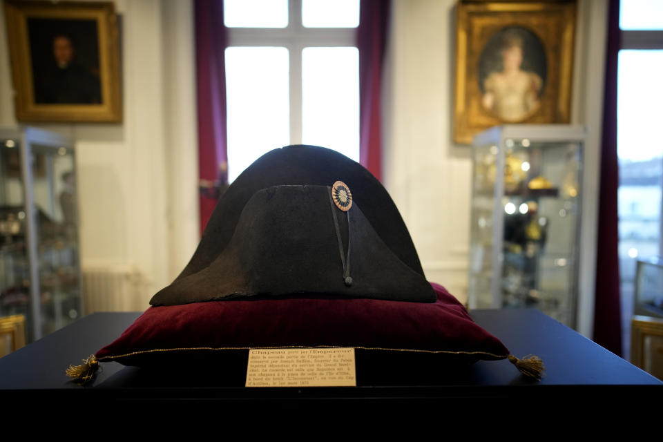 One of the signature broad, black hats that Napoléon wore when he ruled 19th century France and waged war in Europe is on display at Osenat's auction house in Fontainebleau, south of Paris, Friday, Nov. 17, 2023. The hat is tipped to fetch more than half a million euros (dollars) at the auction Sunday of Napoleonic memorabilia patiently collected by a French industrialist. (AP Photo/Christophe Ena)