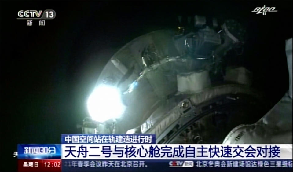 This image made from video footage by China's CCTV shows Tianhe core module's camera footage showing Tianzhou 2 cargo spacecraft approaching on Sunday, May 30, 2021. An automated spacecraft docked with China's new space station Sunday carrying fuel and supplies for its future crew, the Chinese space agency announced. (CCTV via AP Video)