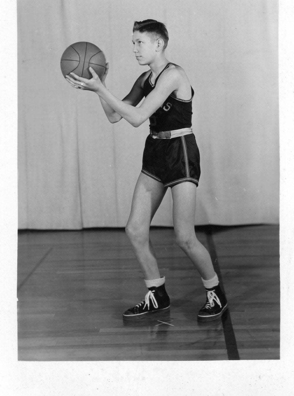 Bill Elbert poses for his Goodland High School junior basketball photo.