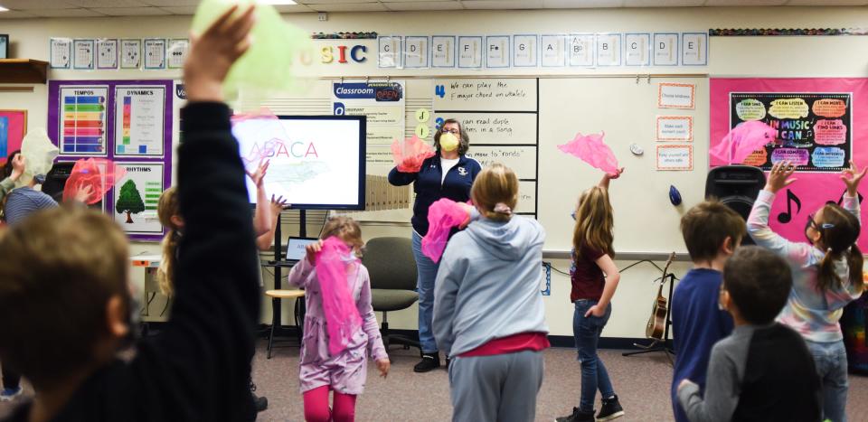 Wacousta Elementary School teacher Cathy Fox works with second-grade students Monday, Feb. 7, 2022, during an exercise where they listen for notes and respond using movement and dance.
