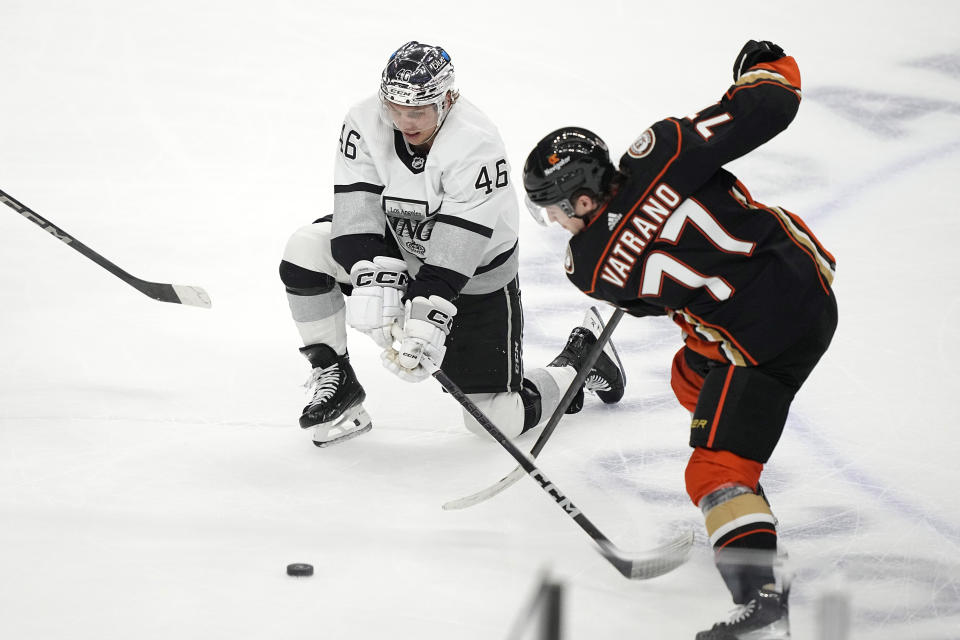 Los Angeles Kings center Blake Lizotte, left, and Anaheim Ducks right wing Frank Vatrano vie for the puck during the first period of an NHL hockey game Saturday, April 13, 2024, in Los Angeles. (AP Photo/Mark J. Terrill)