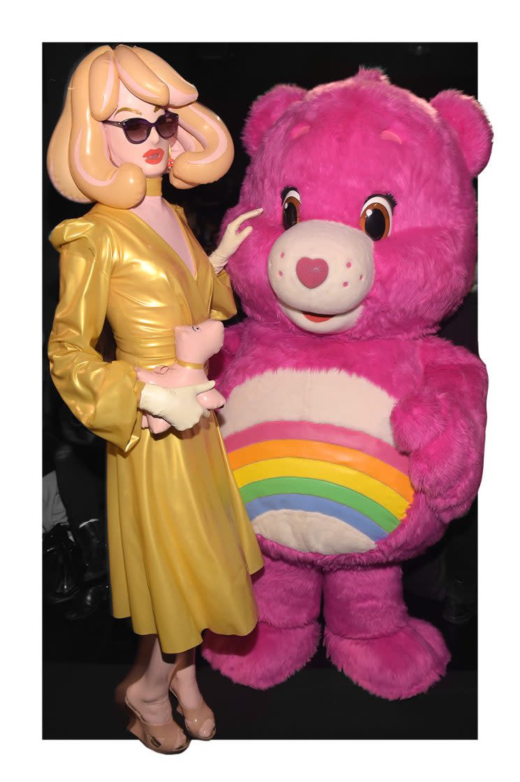 Pandemonia the Blowup Doll and Cheer Bear of the Care Bears attended the Michael Costello fashion show during New York Fashion Week. (Photo: Getty Images)