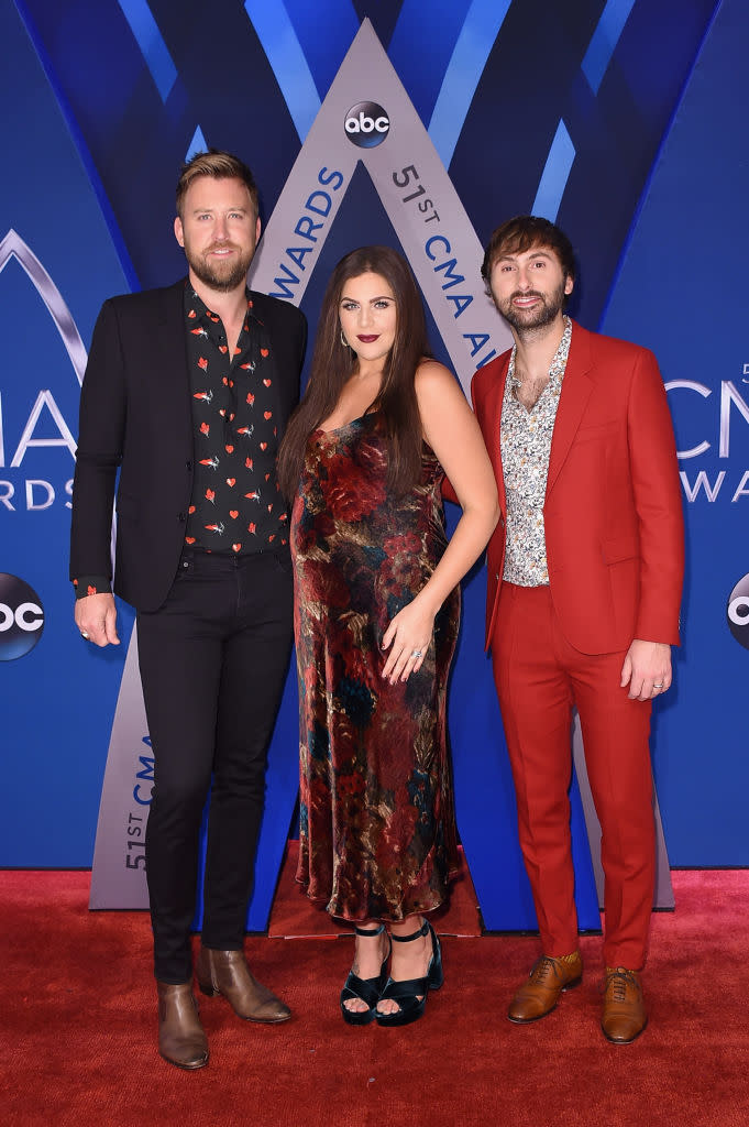 <p>The band was color-coordinated, with a hint of red in each of their looks. (Photo: Getty Images) </p>