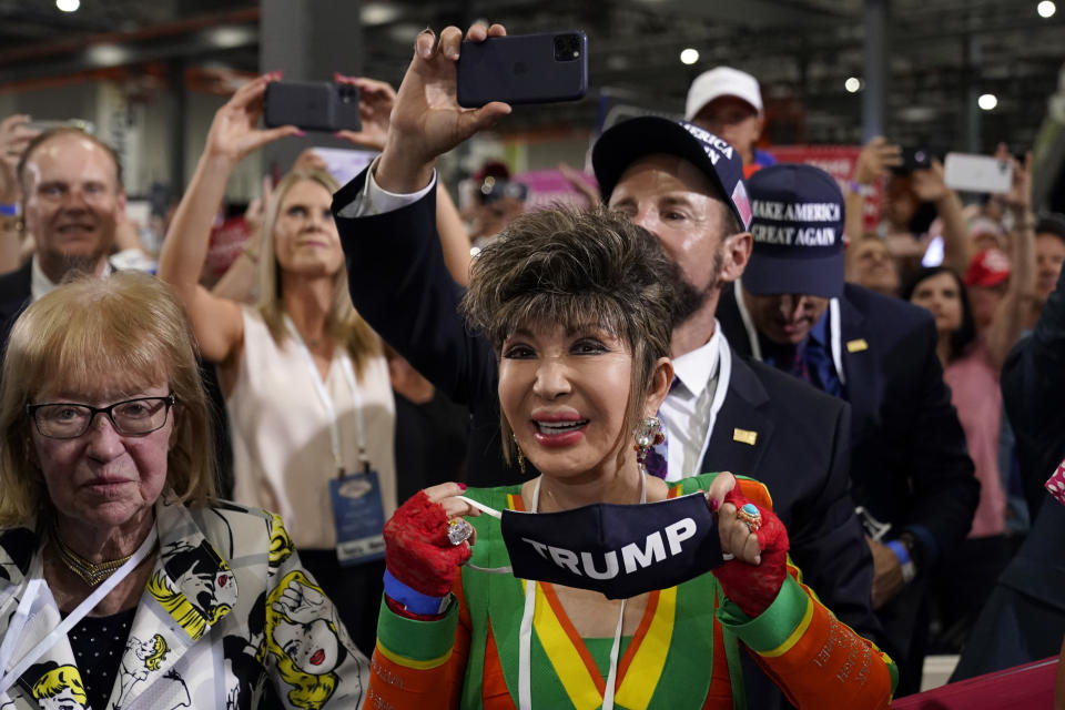 Supporters react as President Donald Trump speaks at a rally at Xtreme Manufacturing, Sunday, Sept. 13, 2020, in Henderson, Nev. (AP Photo/Andrew Harnik)