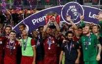 Soccer Football - Leicester City v Liverpool - Pre Season Friendly - The Premier League Asia Trophy - Final - June 22, 2017 Liverpool's Jordan Henderson celebrates winning by lifting the trophy alongside team mates REUTERS/BOBBY YIP