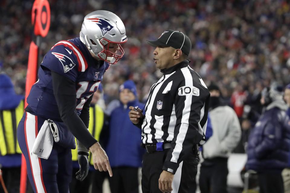 New England Patriots quarterback Tom Brady appeals to down judge Patrick Holt that wide receiver N'Keal Harry had scored a touchdown in the second half of an NFL football game against the Kansas City Chiefs, Sunday, Dec. 8, 2019, in Foxborough, Mass. Harry was ruled out of bounds before he crossed the goal line. (AP Photo/Elise Amendola)