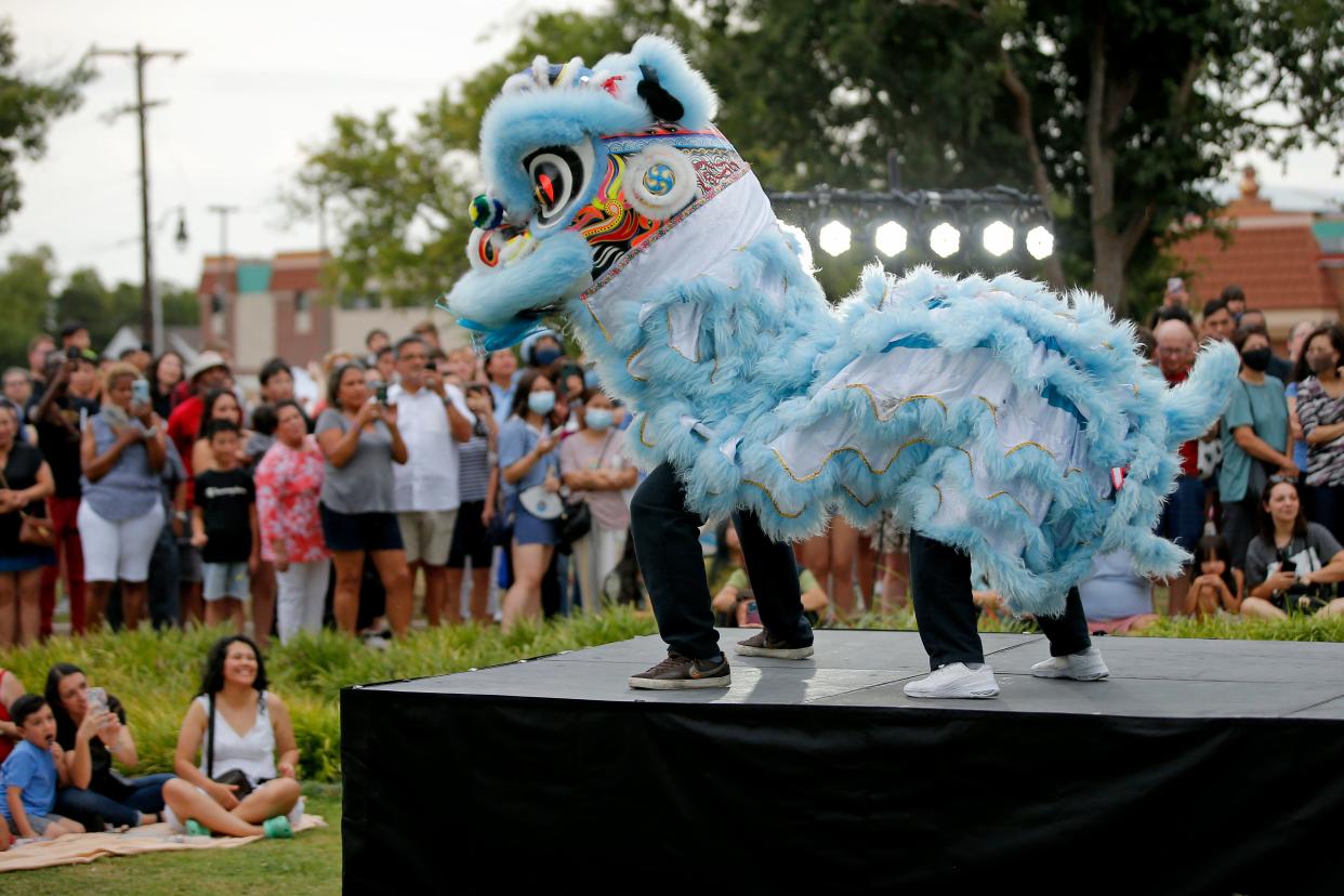 Members of GQ Lion Dance perform in 2022 during the annual Asian Night Market Festival.