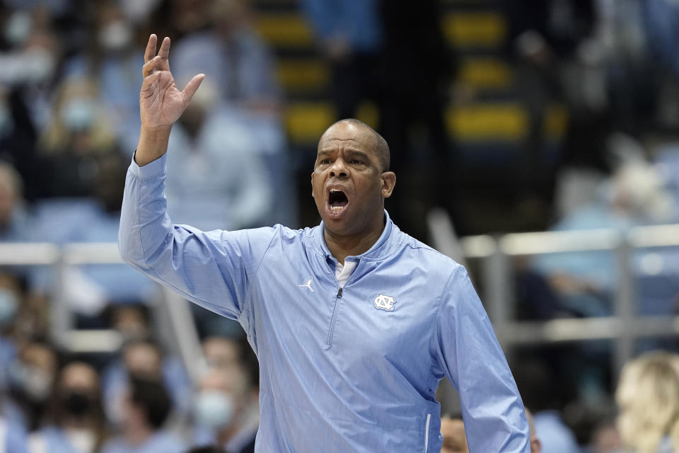 North Carolina head coach Hubert Davis directs his players during the first half of an NCAA college basketball game against Loyola Maryland in Chapel Hill, N.C., Tuesday, Nov. 9, 2021. (AP Photo/Gerry Broome)