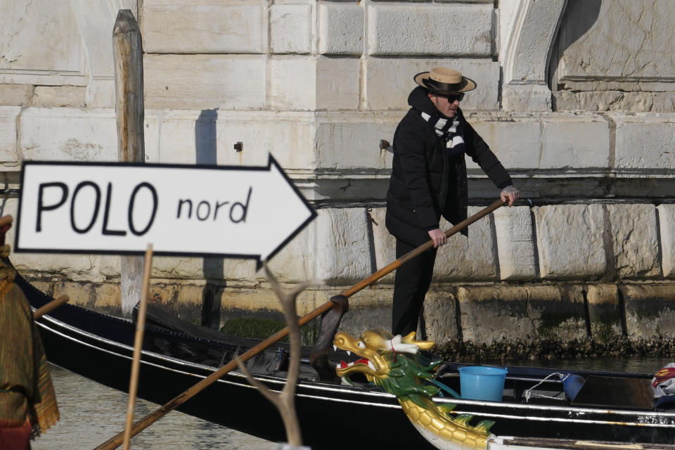 Boats sail during the traditional rowing parade, part of the Venice Carnival in Venice, Italy, Sunday Jan. 28, 2024. Venice is marking the 700th anniversary of the death of Marco Polo with a yearlong series of commemorations, starting with the opening of Carnival season honoring one of the lagoon city's most illustrious native sons. (AP Photo/Luca Bruno)