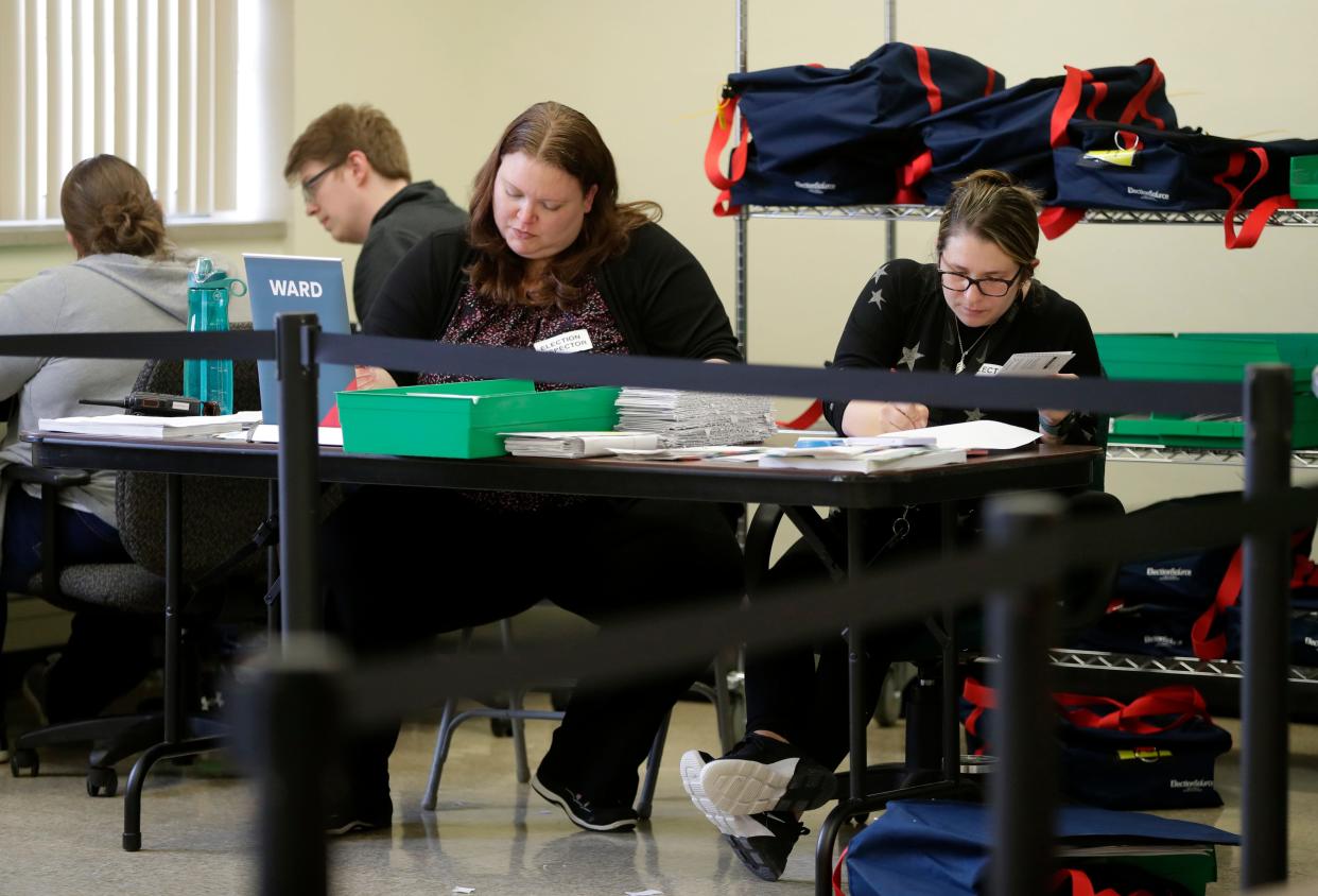 Elections inspectors count ballots on April 5, 2022 at City Hall in Green Bay, Wis.