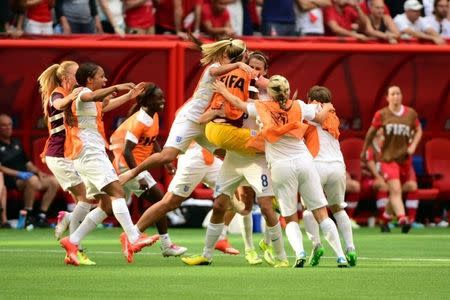 England midfielder Jill Scott (8) celebrates with teammates after defeating Canada in the quarterfinals of the FIFA 2015 Women's World Cup at BC Place Stadium. England won 2-1. Mandatory Credit: Anne-Marie Sorvin-USA TODAY Sports