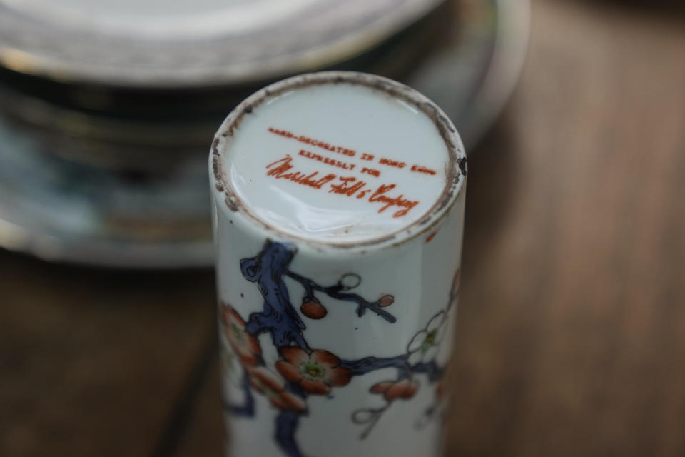 Marshalls's label printed is shown at the bottom of the porcelain at the Yuet Tung China Works, Hong Kong's porcelain factory, in Hong Kong, Wednesday, June 8, 2022. Step into Yuet Tung China Works, Hong Kong’s last remaining hand-painted porcelain factory, and you find yourself surrounded by stacks of dinnerware, each piece painstakingly decorated by hand with vibrant motifs of flowers, fruits and animals.(AP Photo/Kin Cheung)