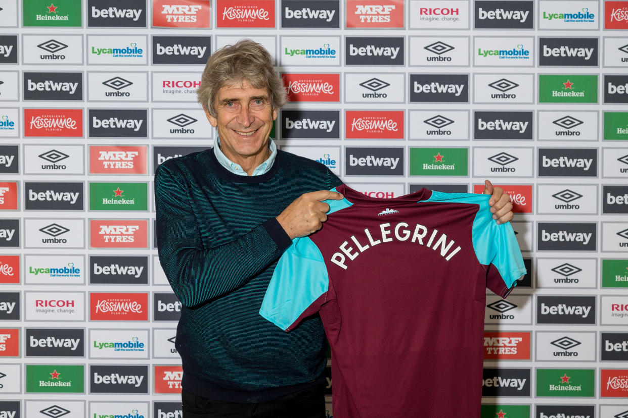 West Ham United’s new manager Manuel Pellegrini poses with a shirt on May 21, 2018 in London, England. (Photo by West Ham United FC/Getty Images)