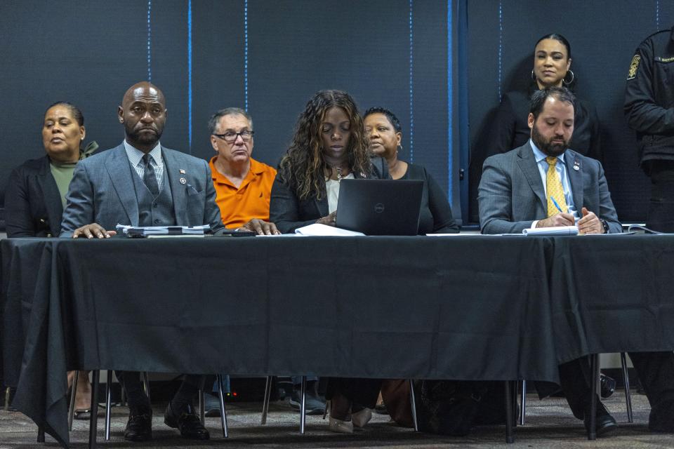 Fulton County District Attorney Special Prosecutor Nathan Wade, left, Executive District Attorney Daysha Young and Attorney Alex Bernice, listen as Superior Court Judge Scott McAfee addresses potential jurors during jury selection for lawyer Kenneth Chesebro's trial, Friday, Oct. 20, 2023, at the Fulton County Courthouse in Atlanta. Jury selection began Friday for Chesebro, the first defendant to go to trial in the Georgia case that accuses former President Donald Trump and others of illegally scheming to overturn the 2020 election in the state. (Alyssa Pointer/Pool Photo via AP)